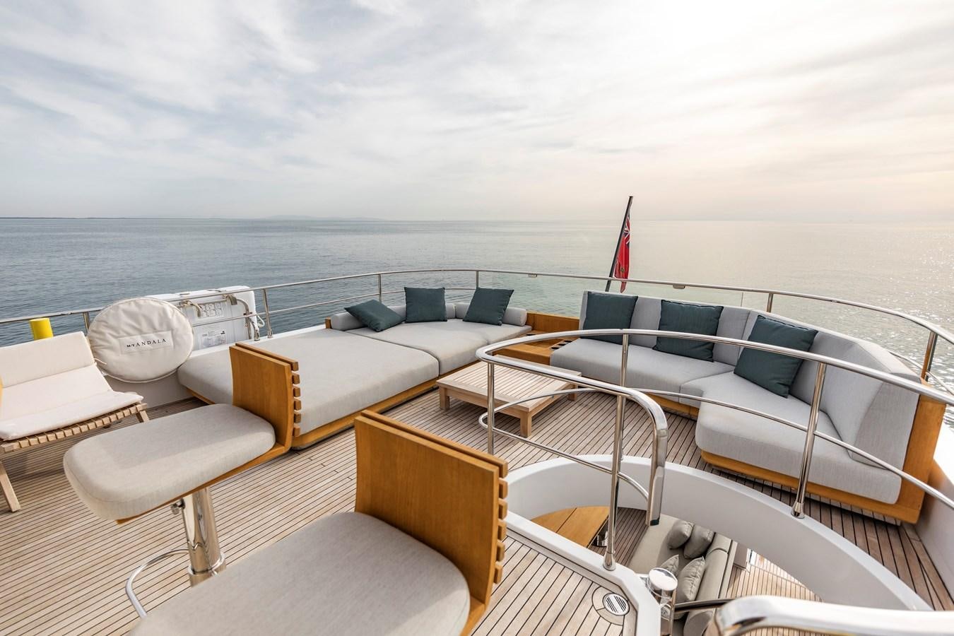 a boat with a deck and chairs on it aboard ANDALA Yacht for Sale