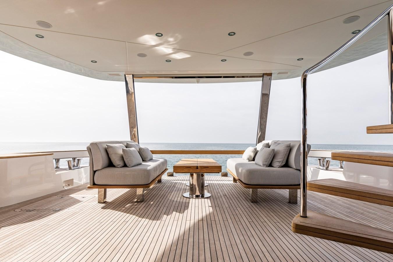 a room with a couch and a table aboard ANDALA Yacht for Sale