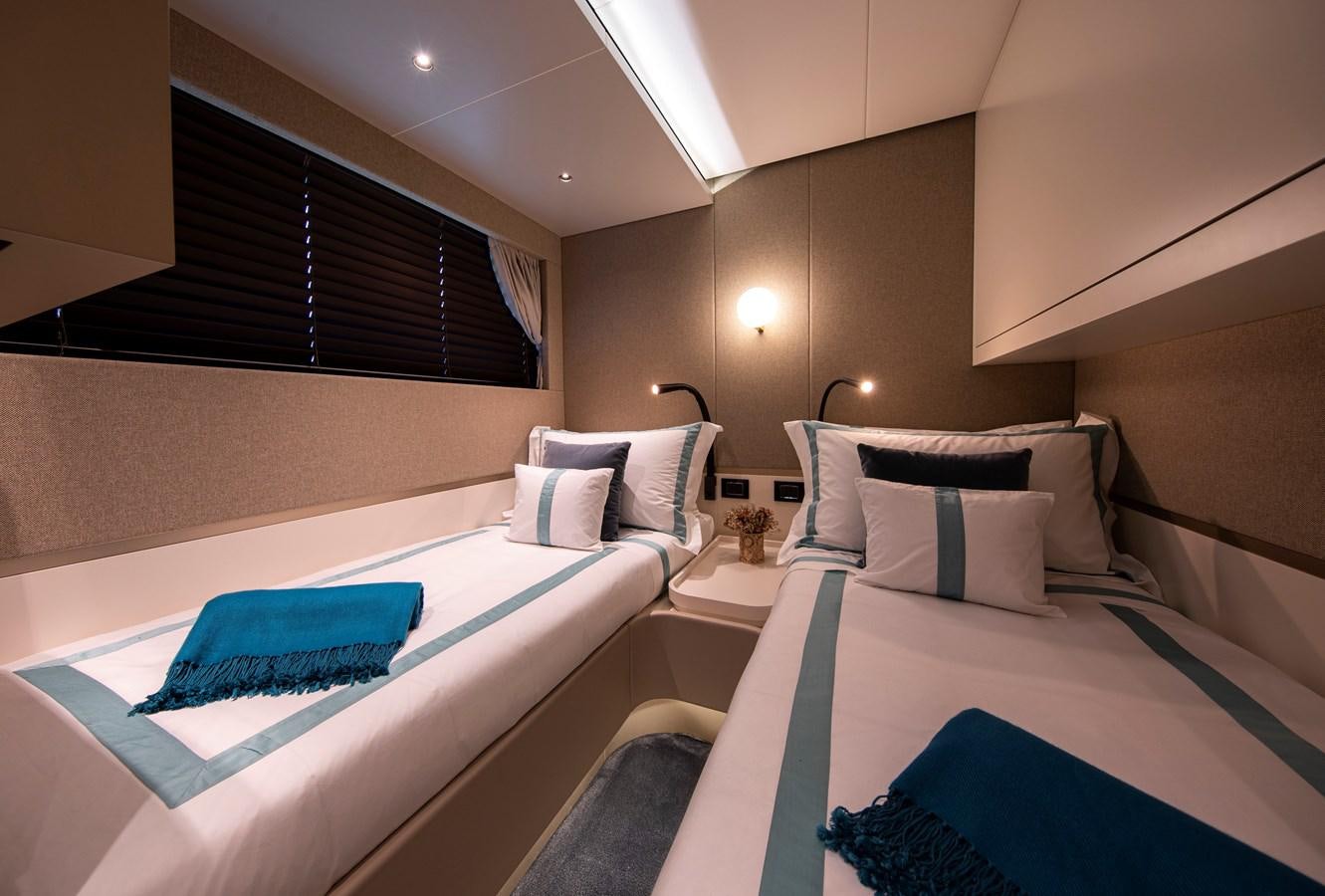 a room with two beds aboard ANDALA Yacht for Sale