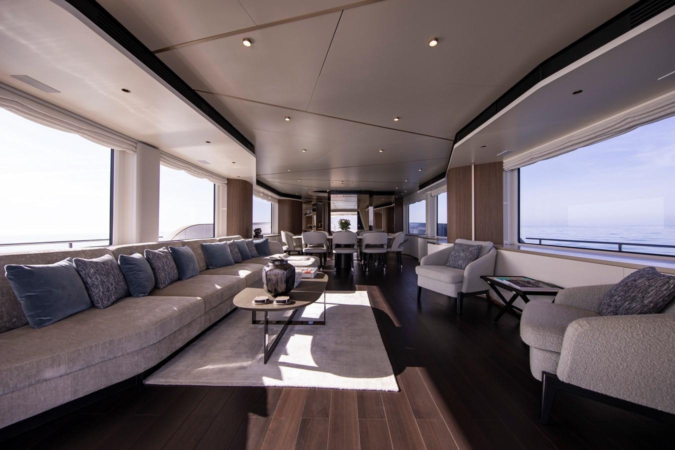 a living room with a couch and a coffee table aboard ANDALA Yacht for Sale