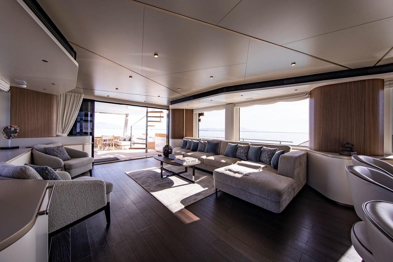 a living room with a large window aboard ANDALA Yacht for Sale