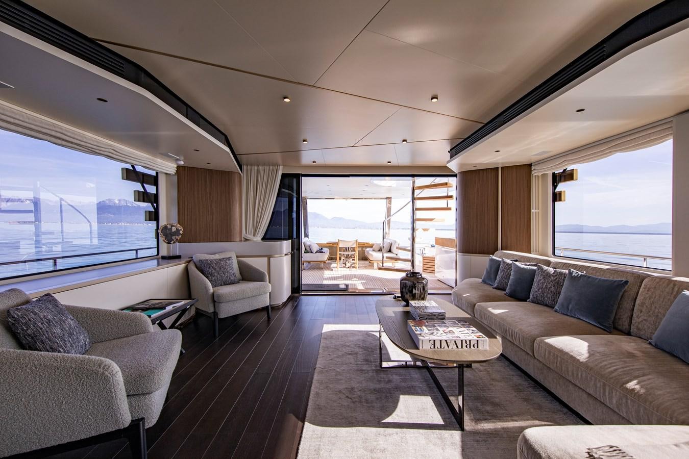 a living room with a large window aboard ANDALA Yacht for Sale