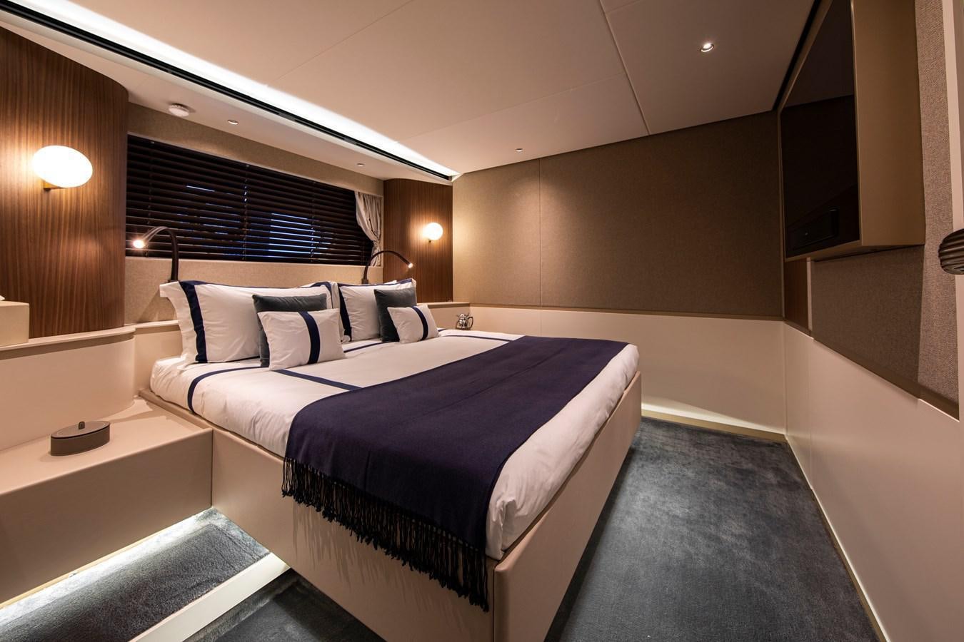 a room with a bed and a window aboard ANDALA Yacht for Sale