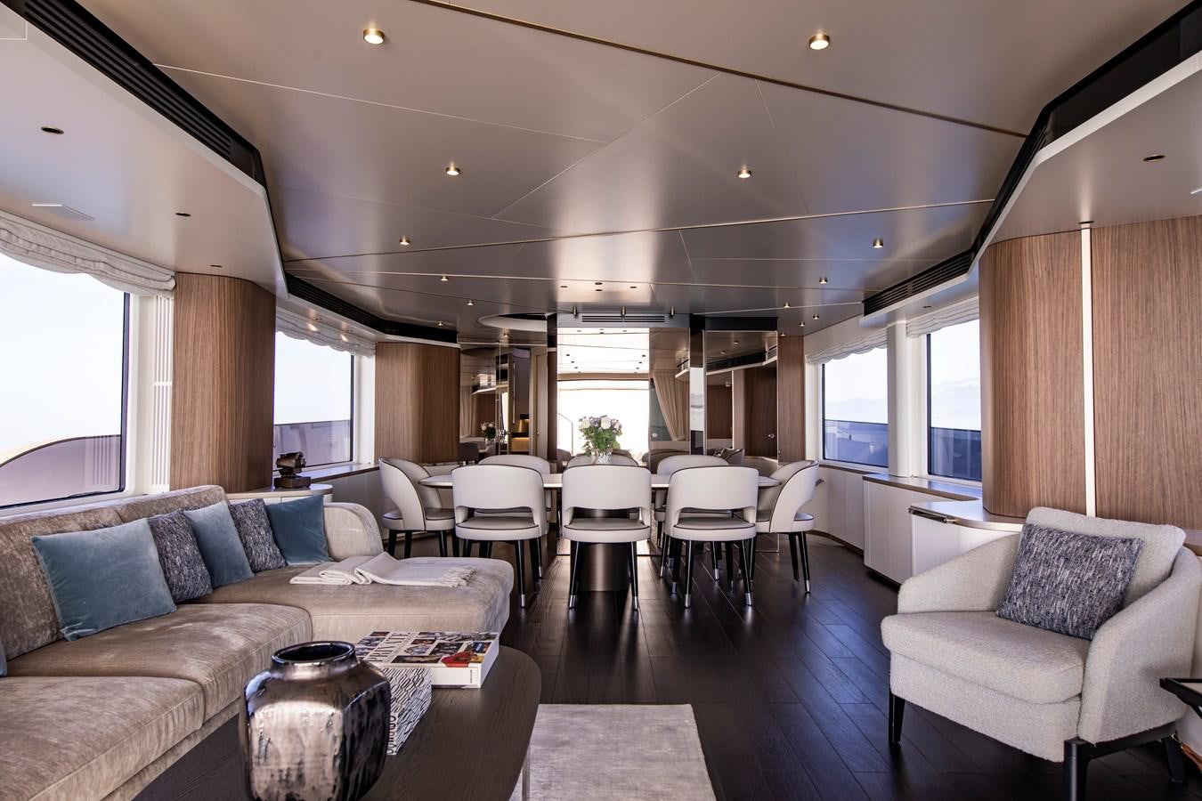 a living room with a couch and a table aboard ANDALA Yacht for Sale