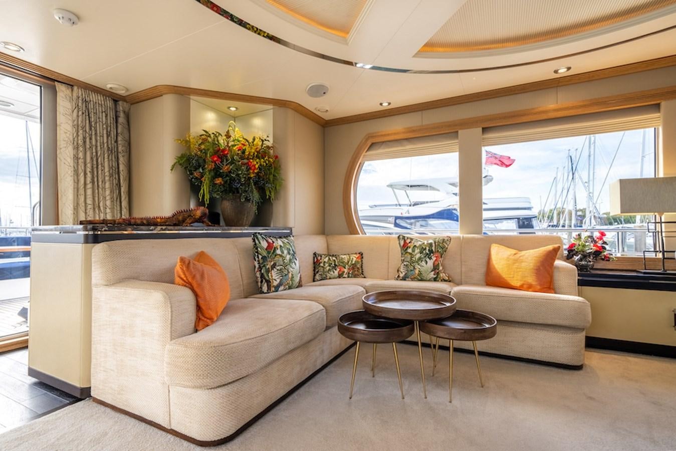 a living room with a couch and a table aboard LA MASCARADE Yacht for Sale