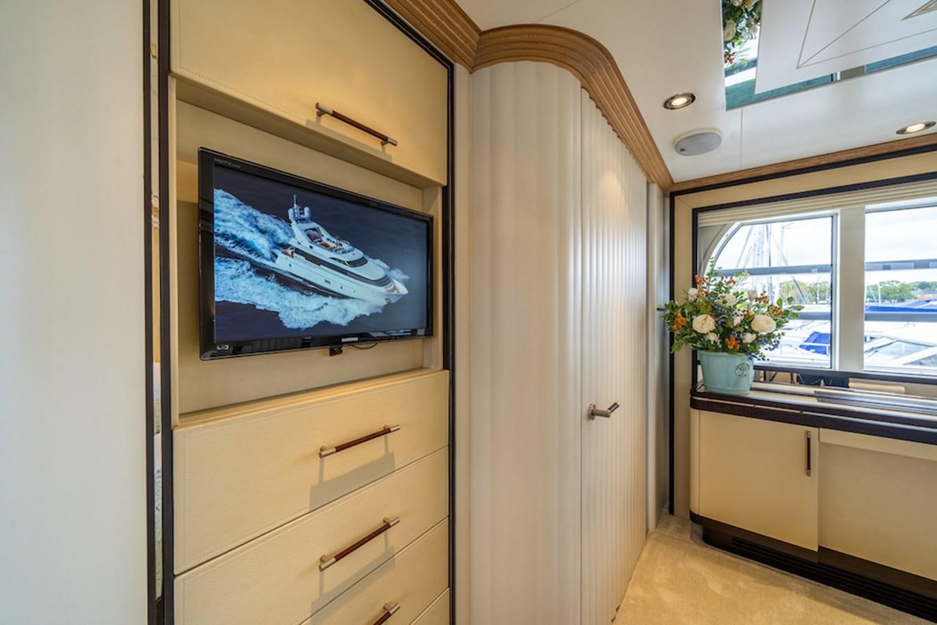 a tv on a wall aboard LA MASCARADE Yacht for Sale