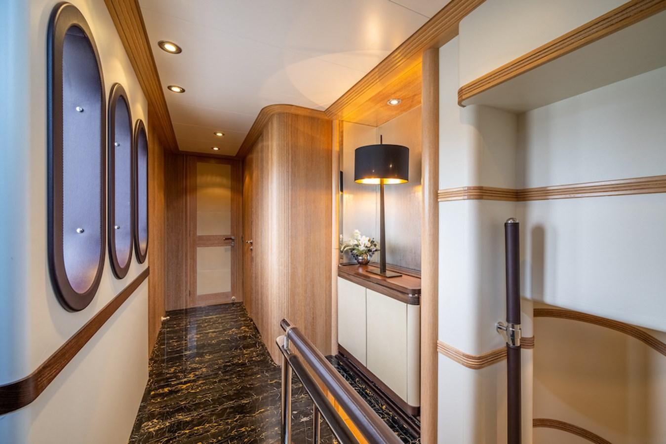 a hallway with wood doors aboard LA MASCARADE Yacht for Sale