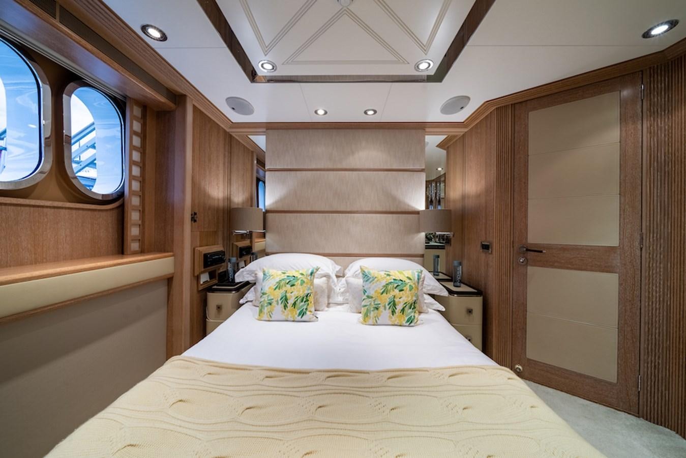 a cabin with a bed aboard LA MASCARADE Yacht for Sale