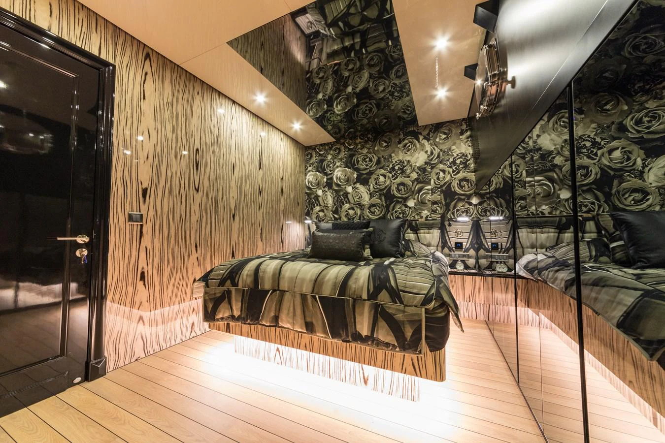a room with a bed and a couch aboard EMANUEL Yacht for Sale