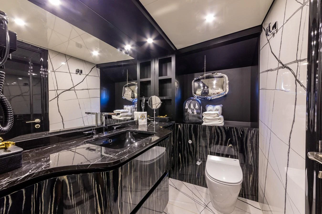 a bathroom with a large mirror aboard EMANUEL Yacht for Sale