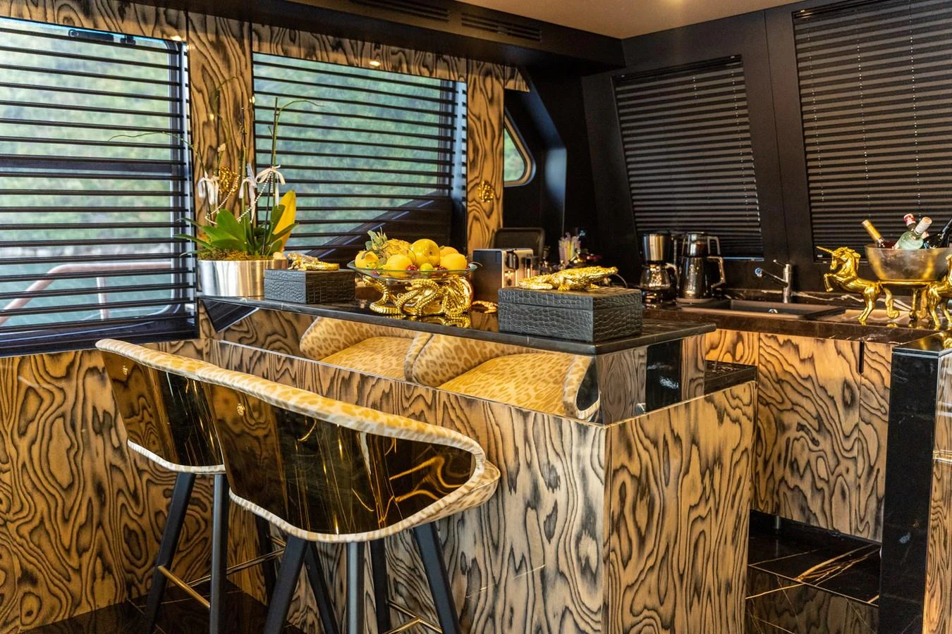 a kitchen with a table and chairs aboard EMANUEL Yacht for Sale
