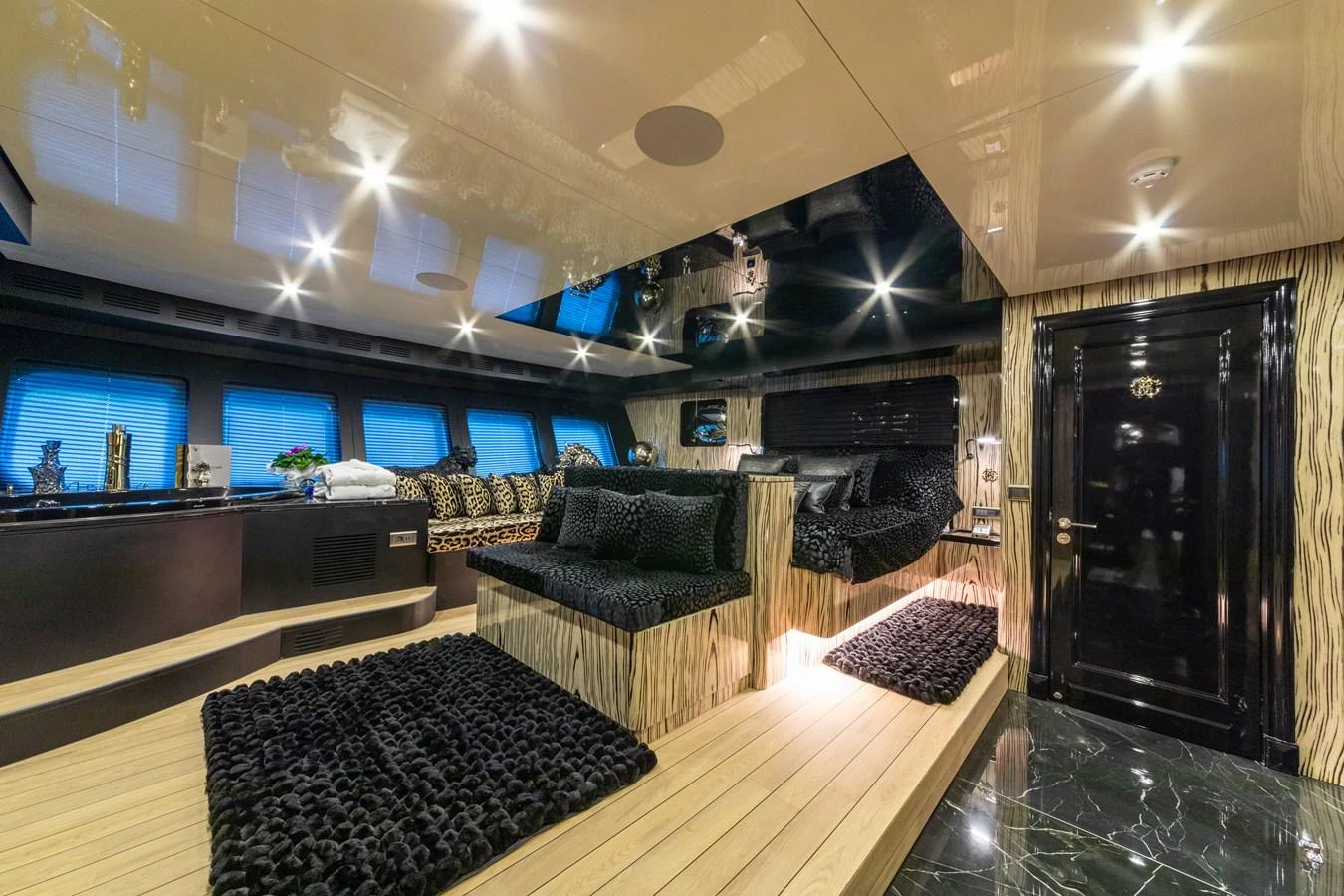 a living room with a large fireplace aboard EMANUEL Yacht for Sale