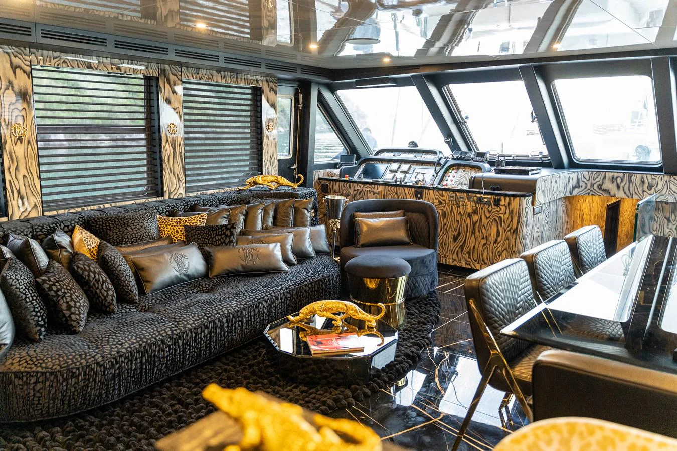 a room with a couch and a table aboard EMANUEL Yacht for Sale
