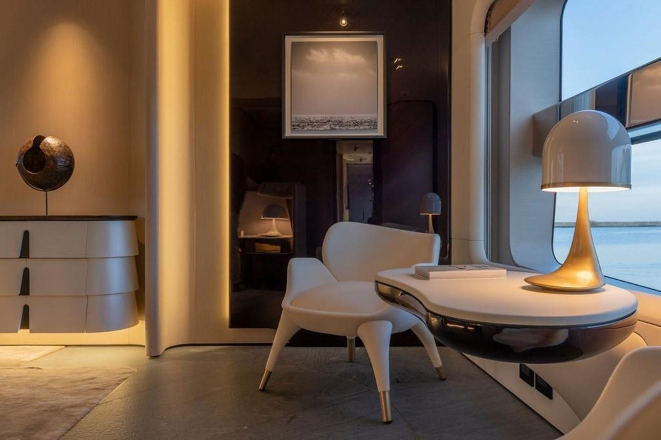 a room with a table and a lamp aboard SHABBY Yacht for Sale