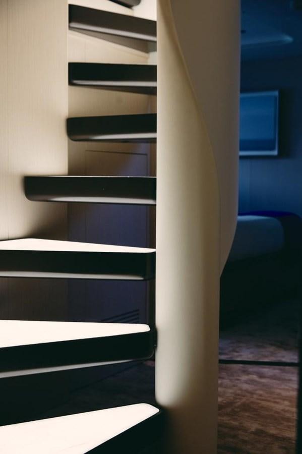 a set of stairs leading up to a blue wall aboard SHABBY Yacht for Sale