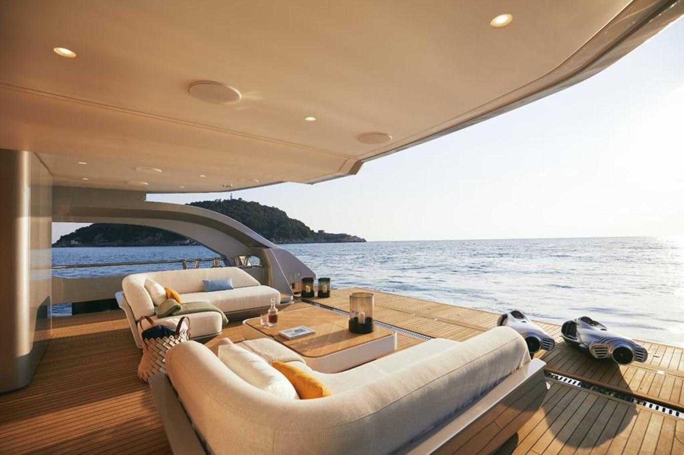 a room with a couch and a table and chairs on a deck aboard SHABBY Yacht for Sale