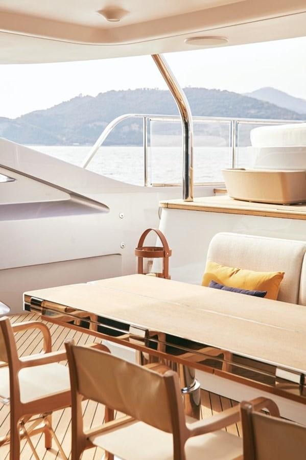 a table on a balcony aboard SHABBY Yacht for Sale