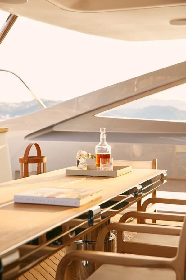 a bottle of wine on a table aboard SHABBY Yacht for Sale