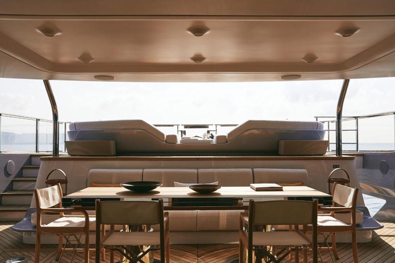 a room with a table and chairs aboard SHABBY Yacht for Sale