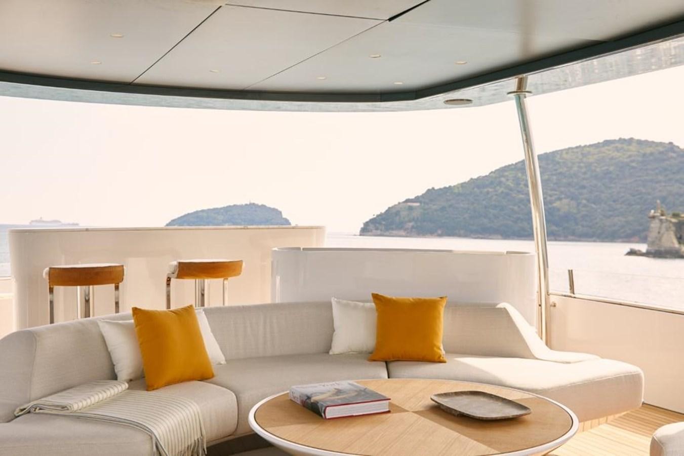 a room with a couch and a table and chairs aboard SHABBY Yacht for Sale