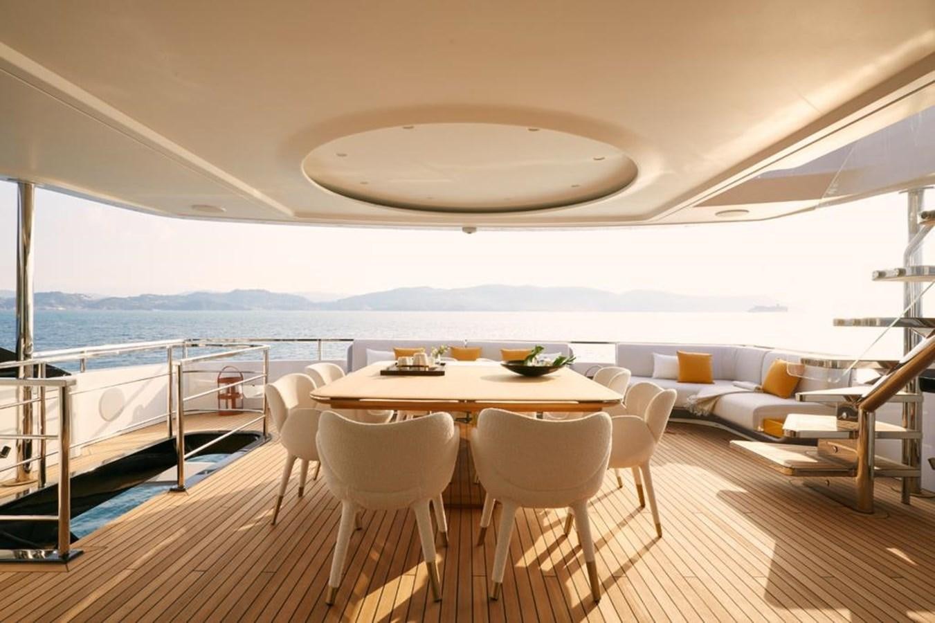a table and chairs on a deck aboard SHABBY Yacht for Sale