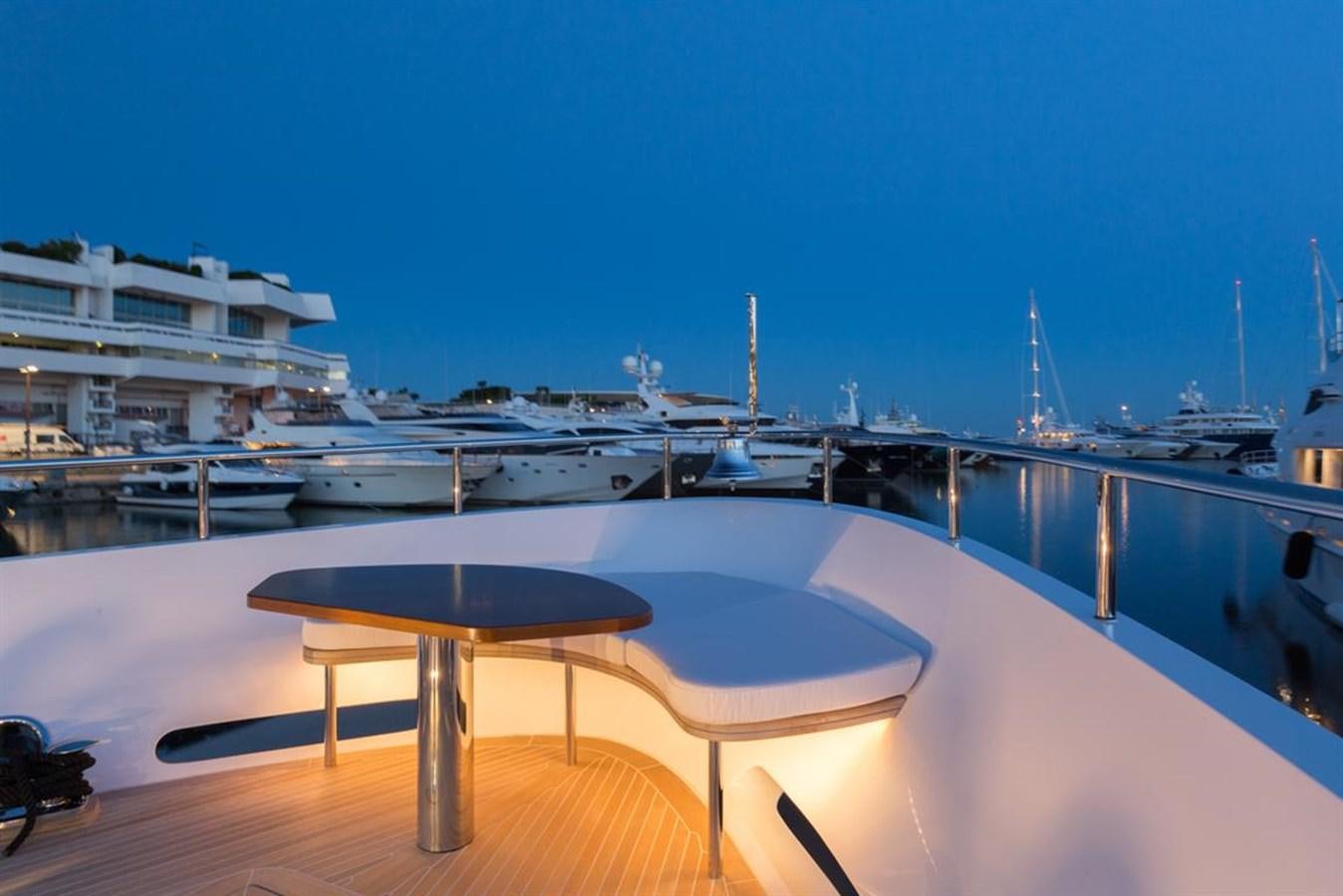 a table on a deck aboard GALA Yacht for Sale
