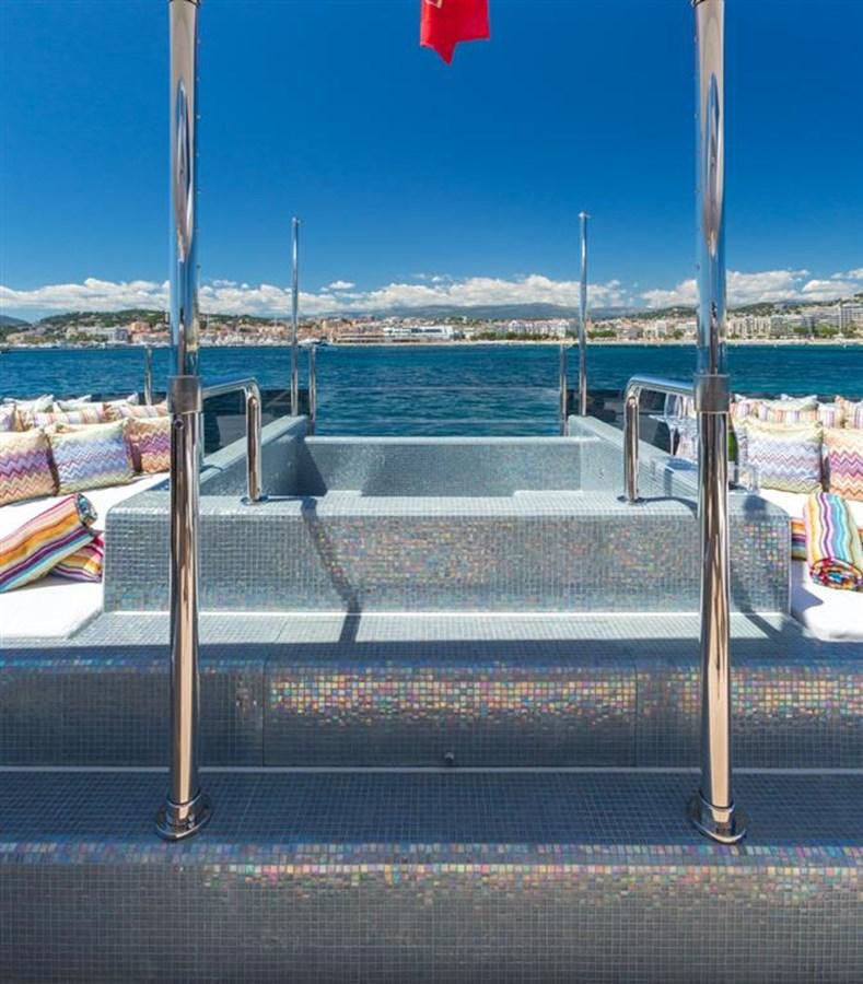 a view of a beach from a balcony aboard GALA Yacht for Sale