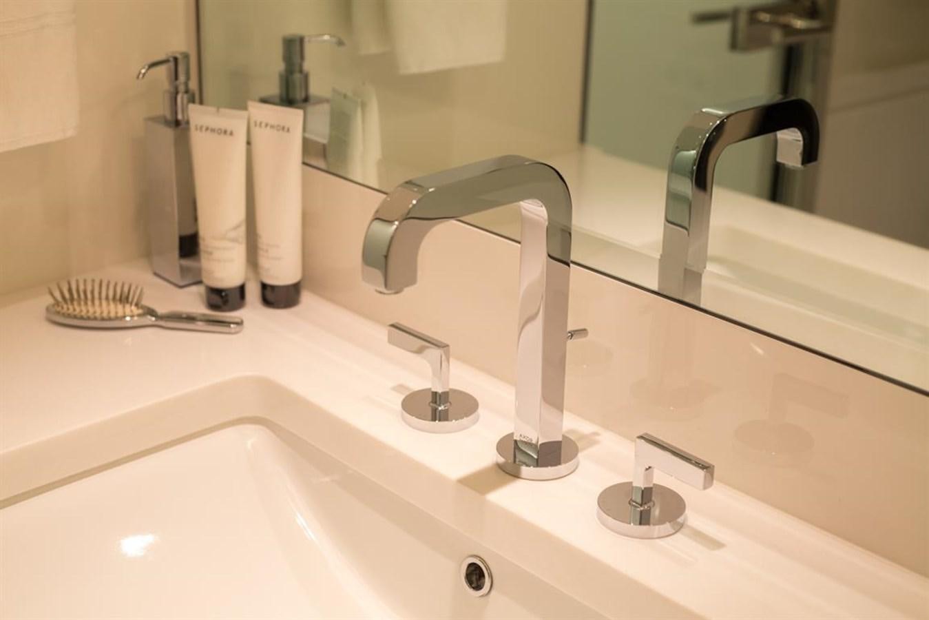 a bathroom sink with a faucet aboard GALA Yacht for Sale