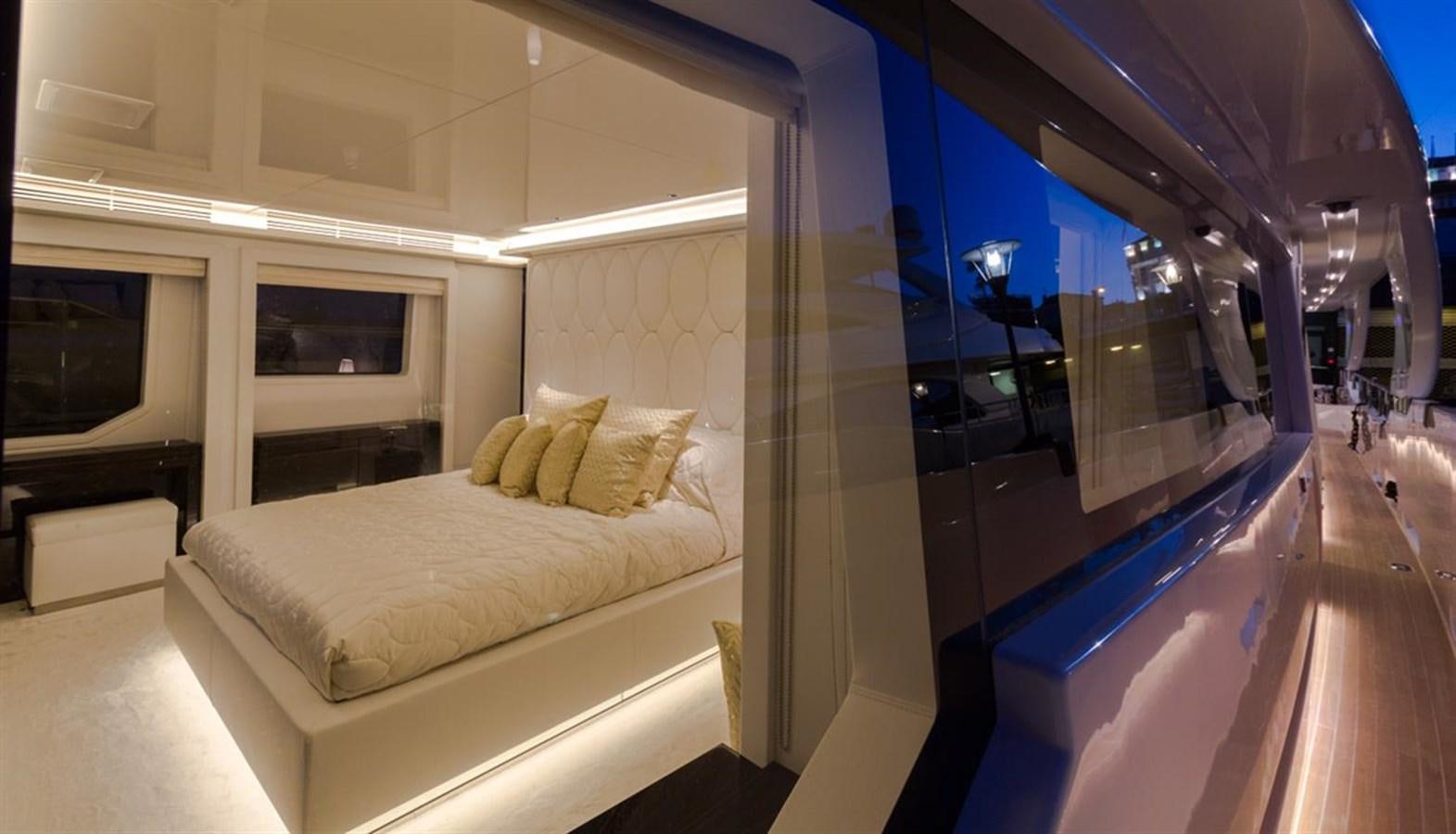a room with a bed and a window aboard GALA Yacht for Sale
