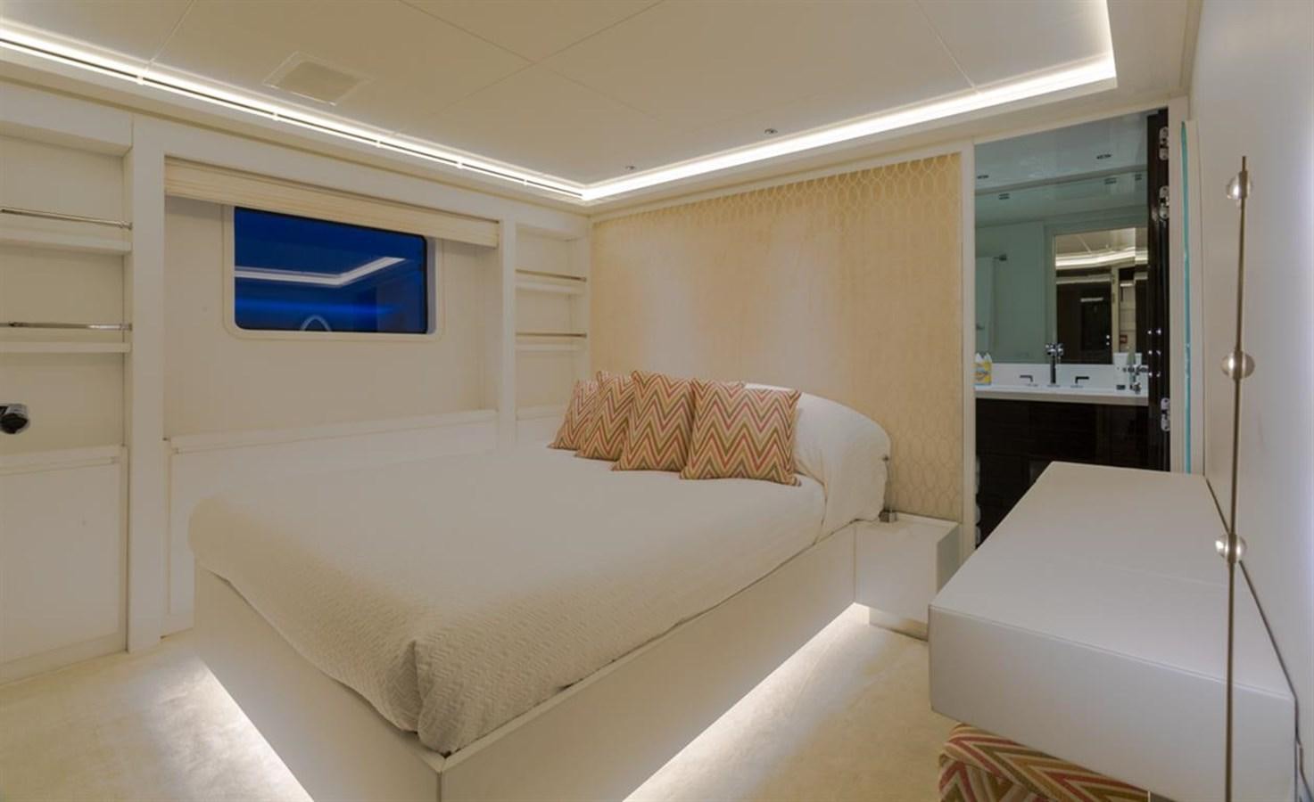 a room with a bed and a desk aboard GALA Yacht for Sale