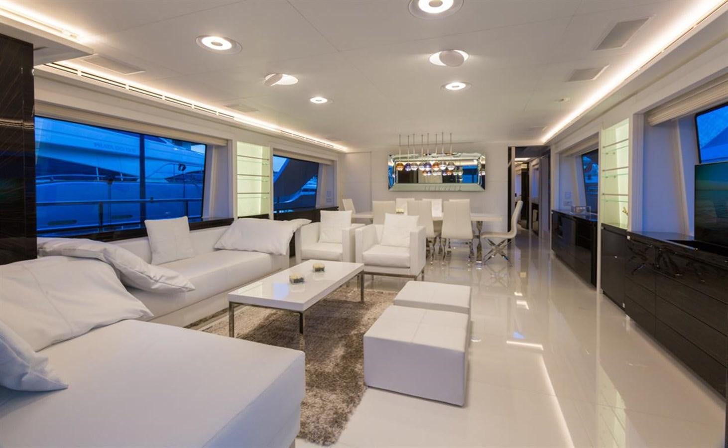 a living room with a large screen aboard GALA Yacht for Sale