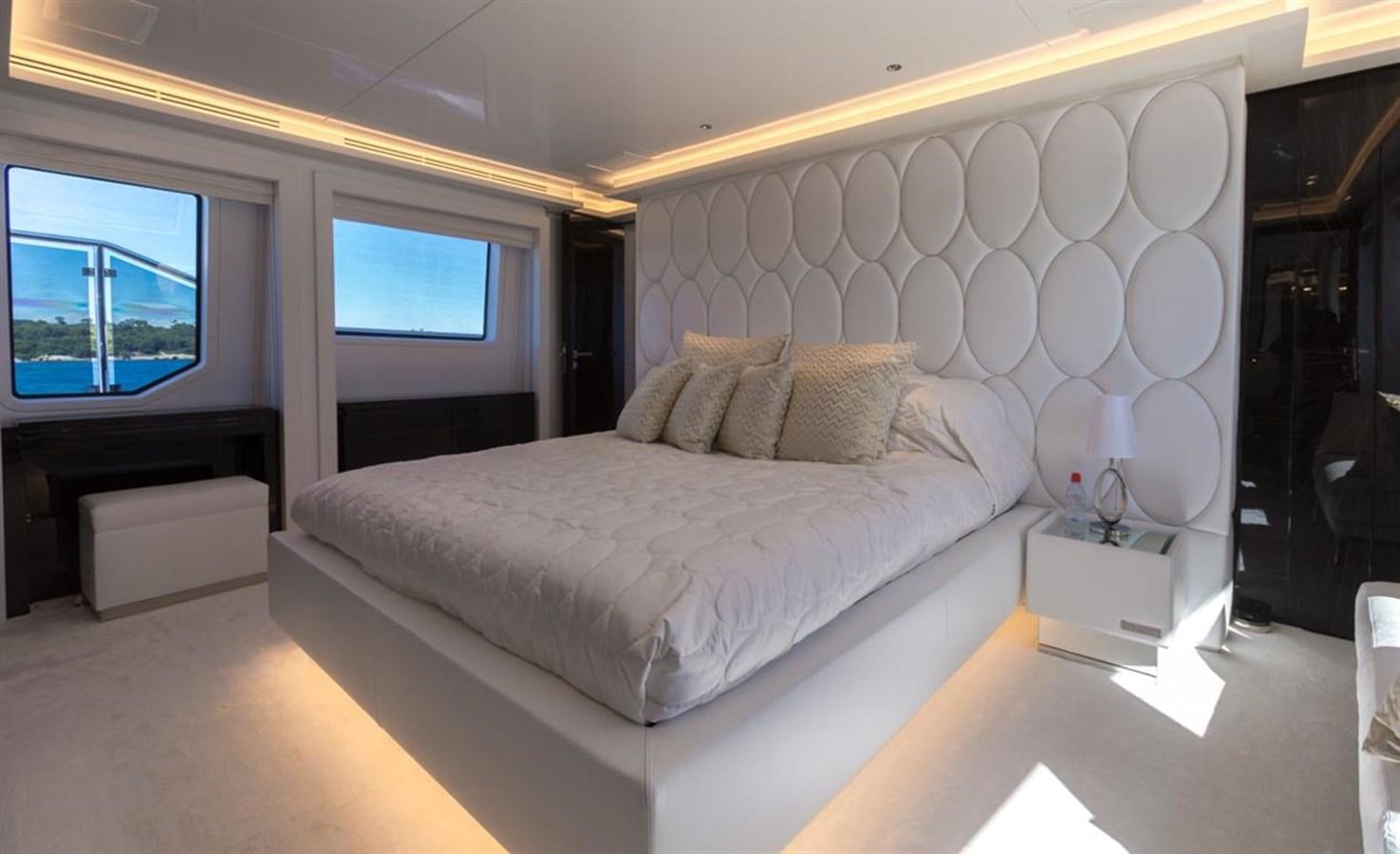 a large bed in a room aboard GALA Yacht for Sale