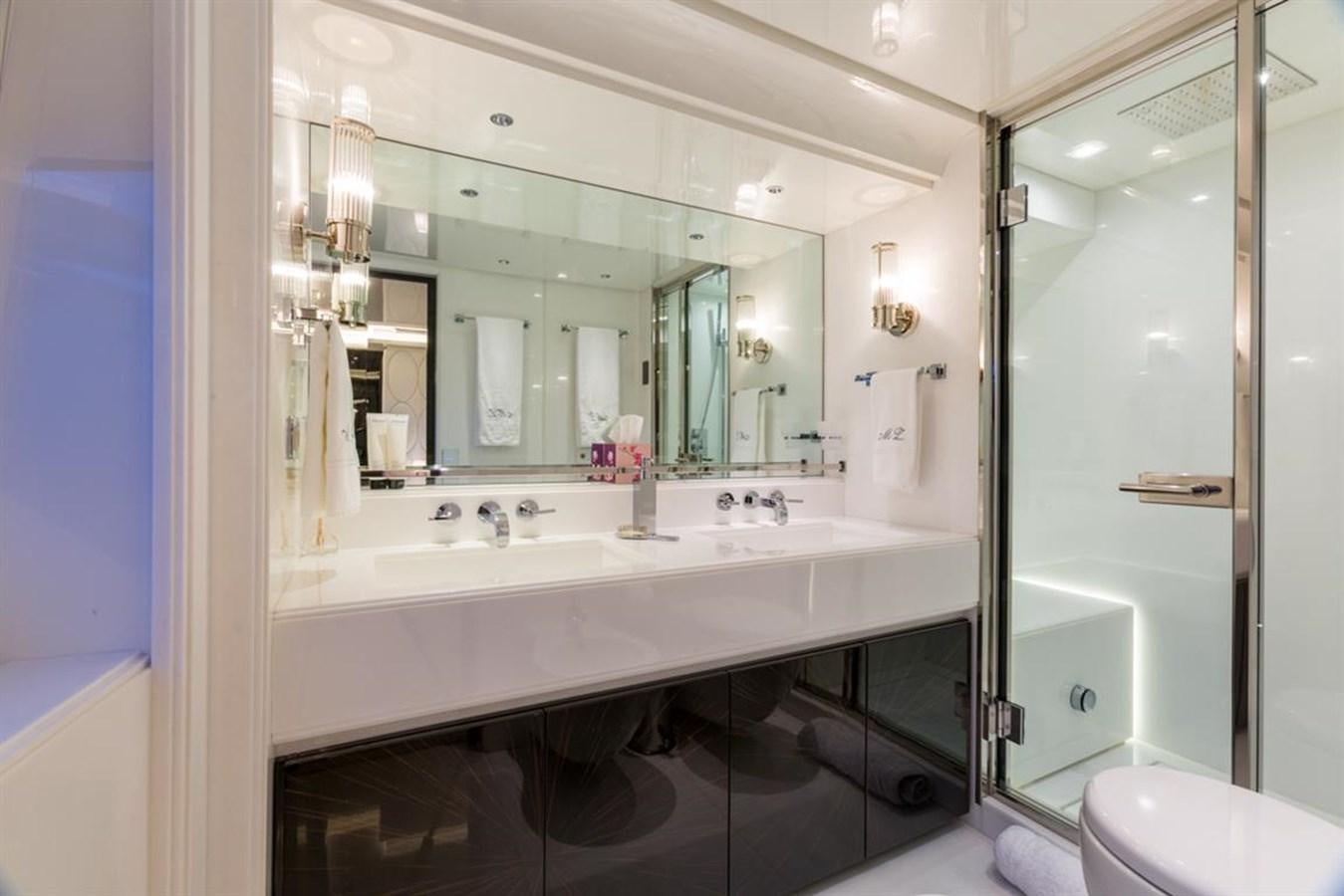 a bathroom with a large mirror aboard GALA Yacht for Sale