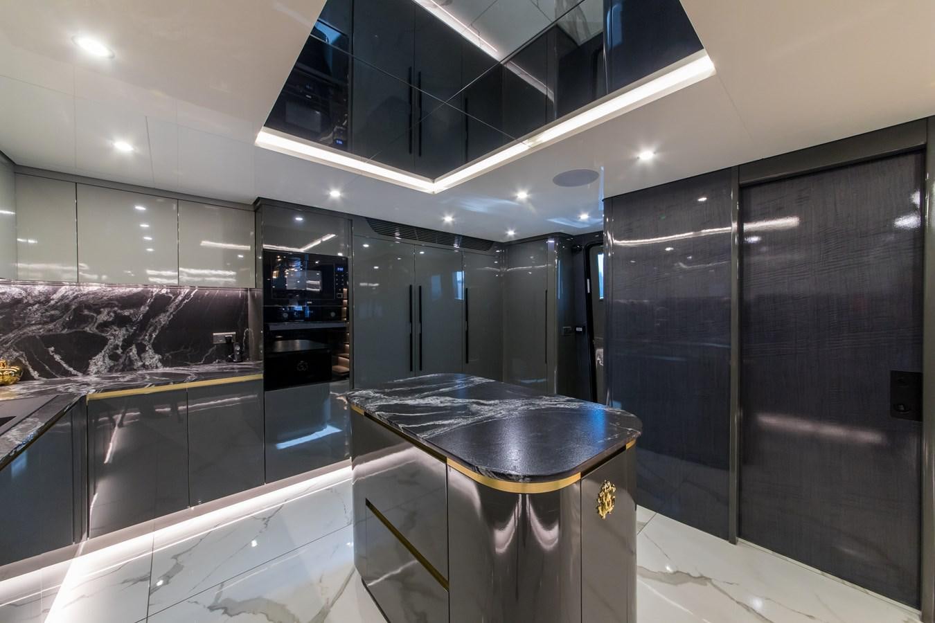 a kitchen with a large counter aboard QUEEN KARINA Yacht for Sale