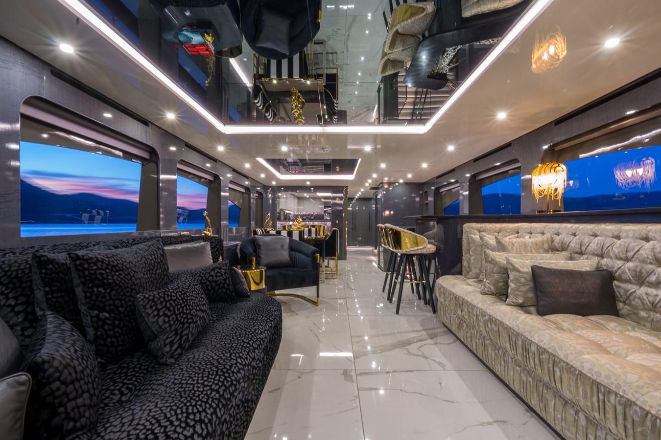 a room with couches and a television aboard QUEEN KARINA Yacht for Sale