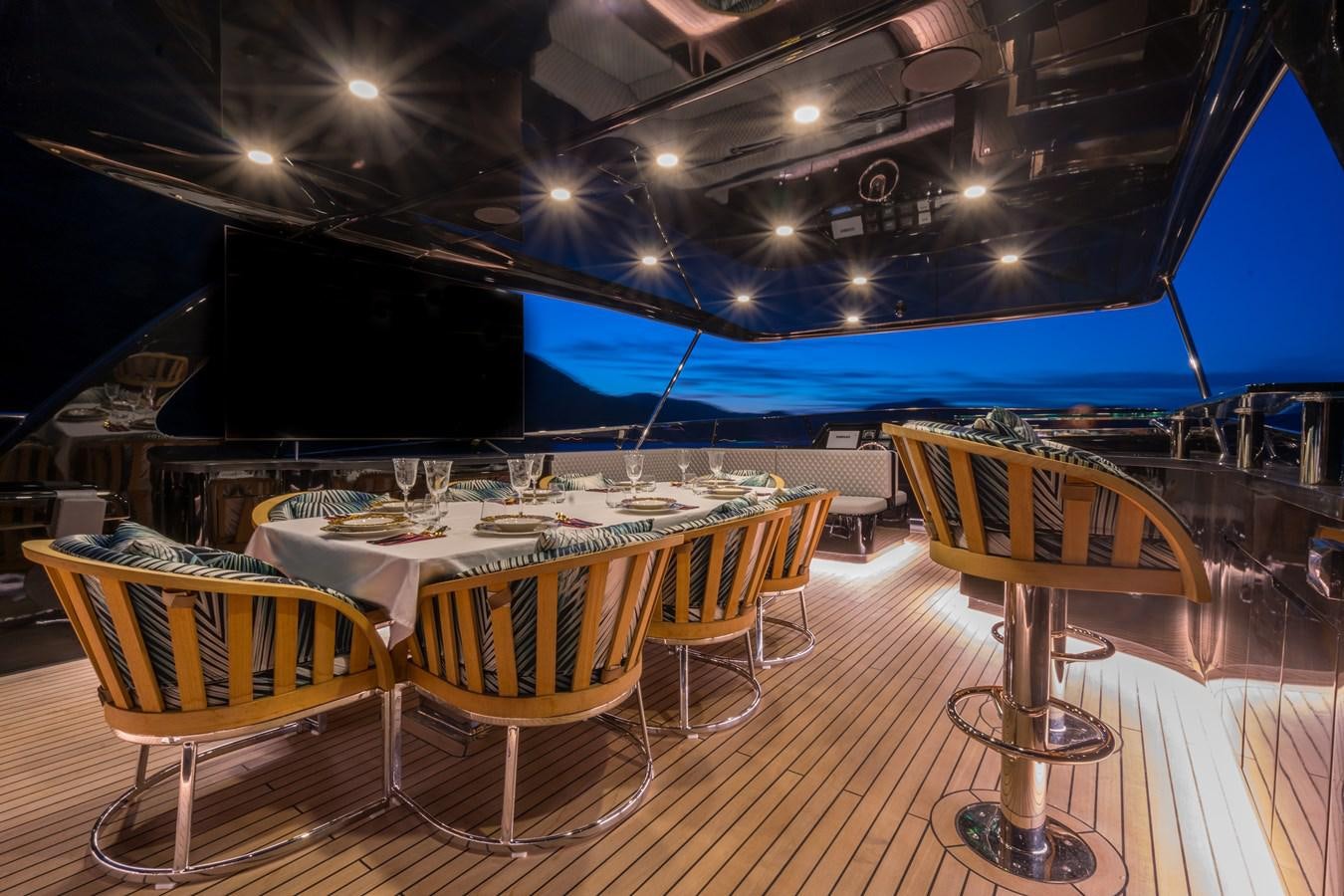 a room with a table and chairs aboard QUEEN KARINA Yacht for Sale