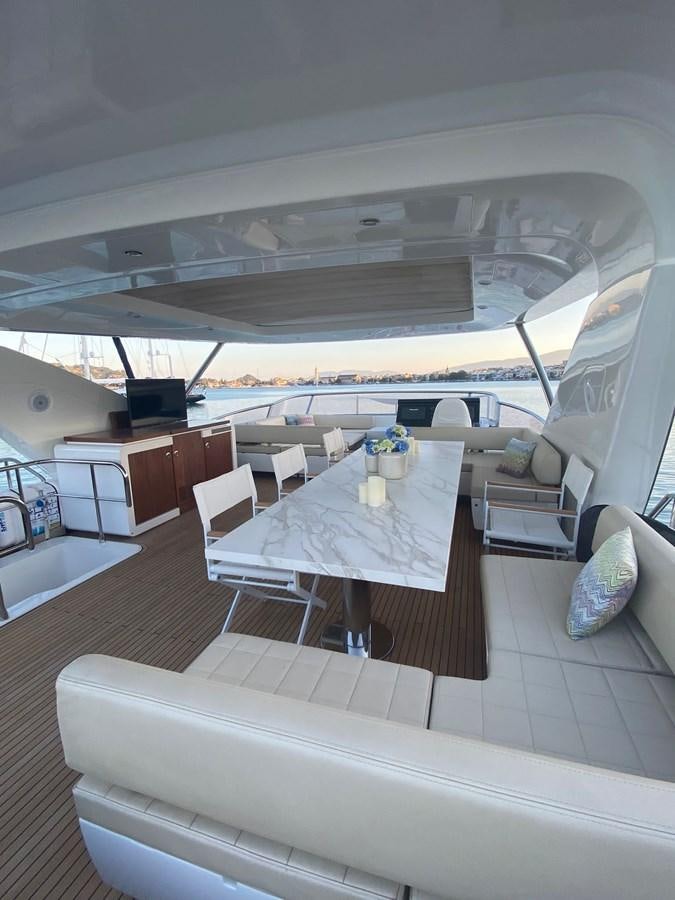 a room with a table and chairs aboard FREE MIND Yacht for Sale