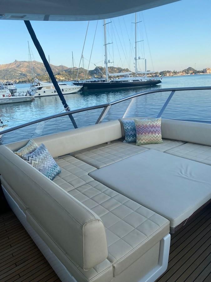 a deck with a view of a marina and boats aboard FREE MIND Yacht for Sale