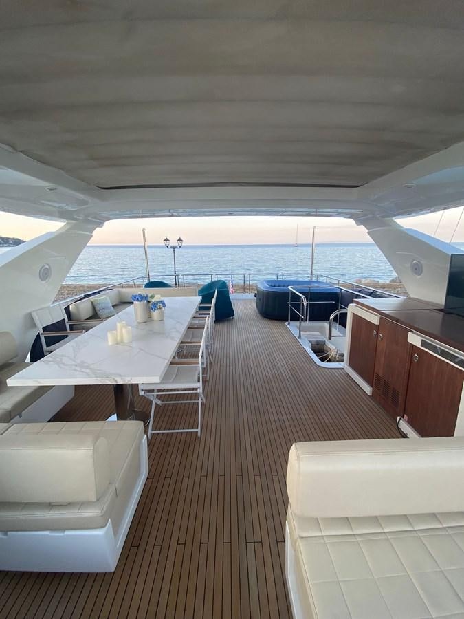 a room with a table and chairs aboard FREE MIND Yacht for Sale