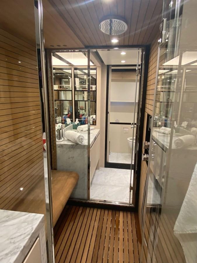 a bathroom with a glass shower aboard FREE MIND Yacht for Sale