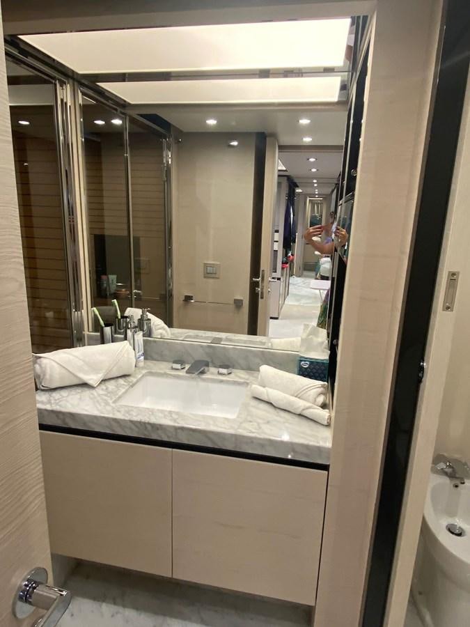a bathroom with a large mirror aboard FREE MIND Yacht for Sale