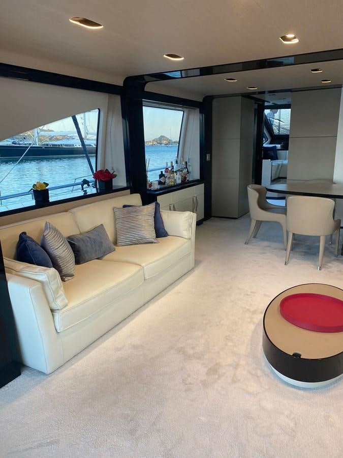 a living room with a couch and a table aboard FREE MIND Yacht for Sale
