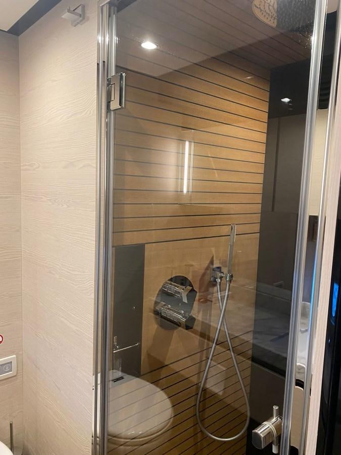 a shower unit with a mirror aboard FREE MIND Yacht for Sale