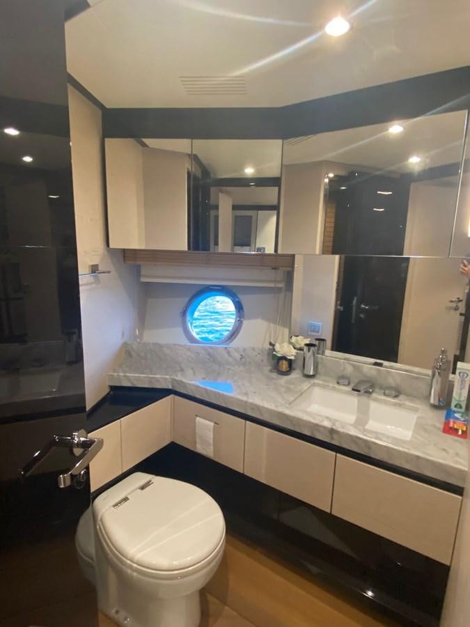 a bathroom with a large mirror aboard FREE MIND Yacht for Sale