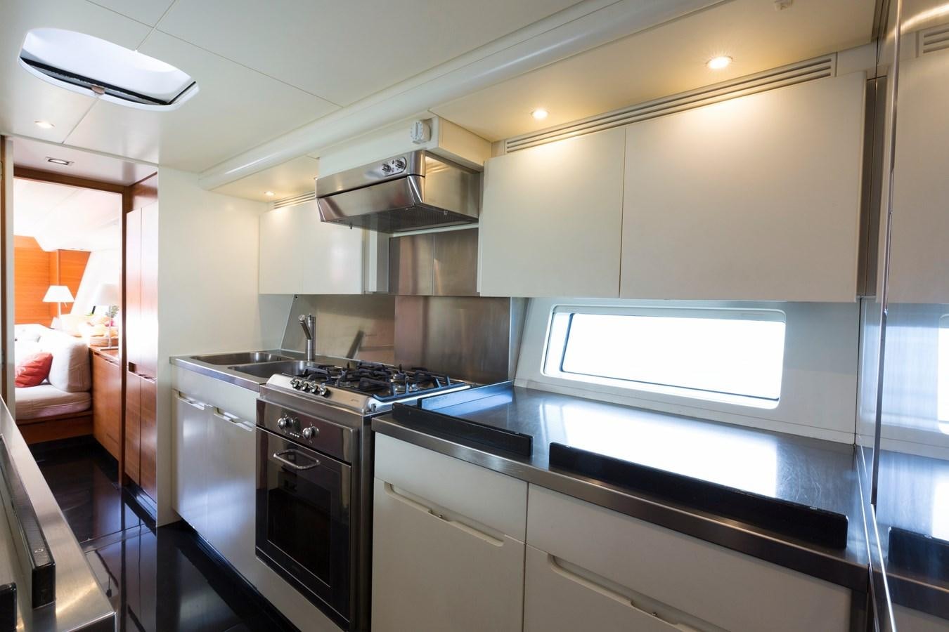 a kitchen with a stove and a microwave aboard WALLY LOVE Yacht for Sale