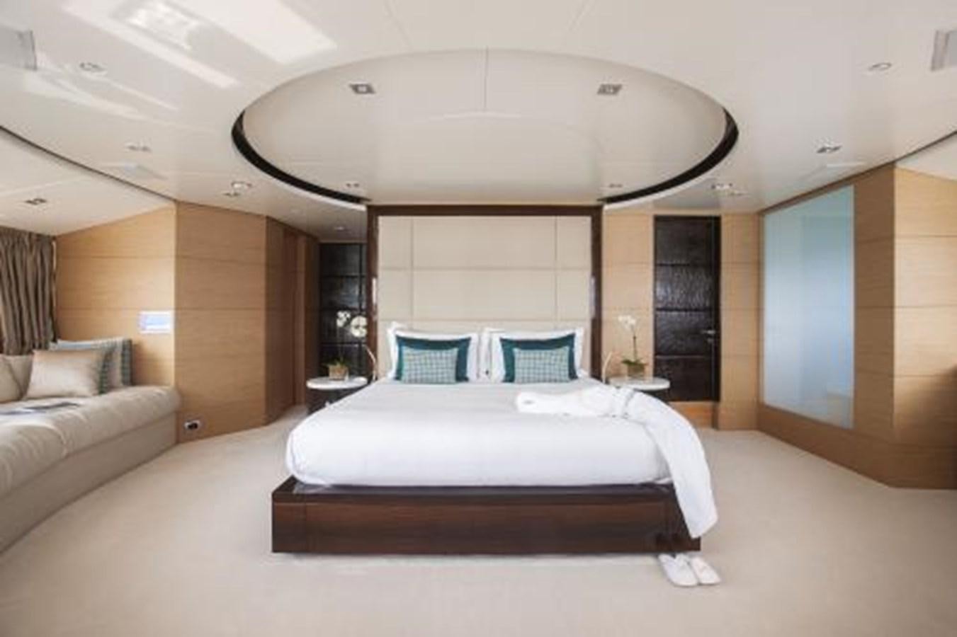 a room with a bed and a couch aboard SUR LA MER Yacht for Sale