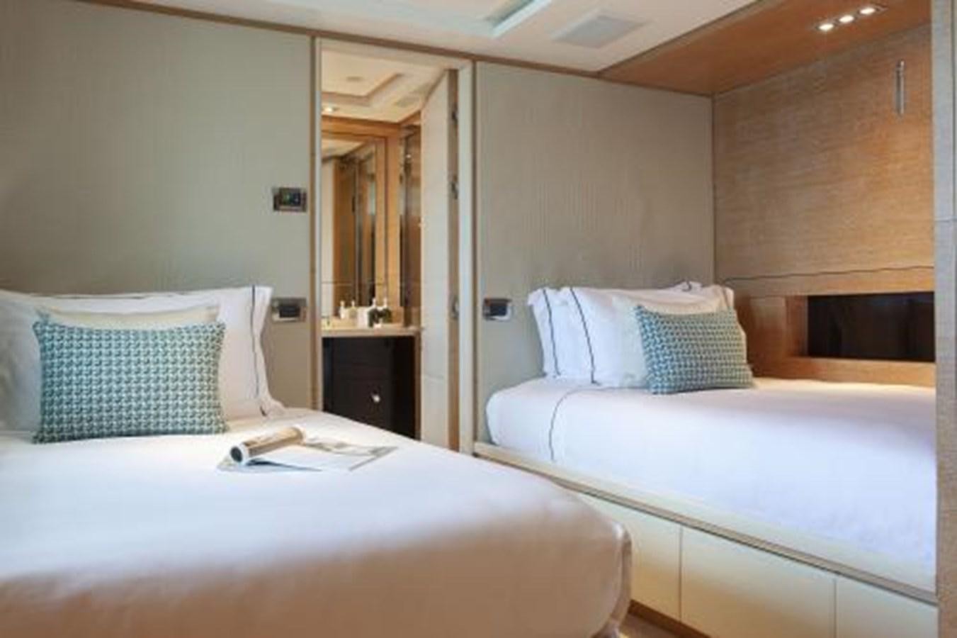 a hotel room with two beds aboard SUR LA MER Yacht for Sale