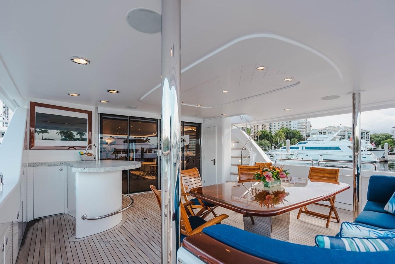 a large room with a table and chairs and a pool aboard LA LADY Yacht for Sale