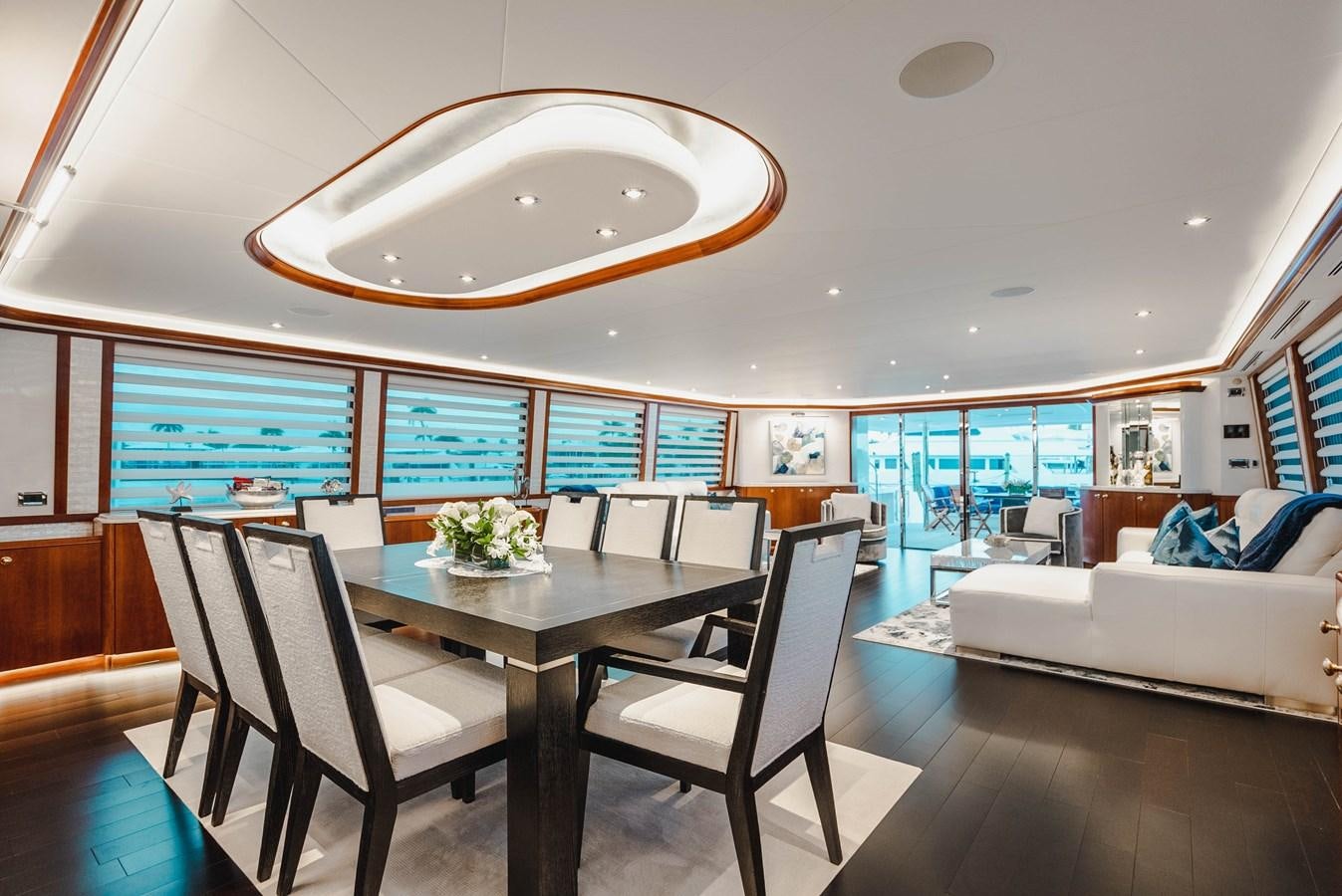 a room with a table and chairs aboard LA LADY Yacht for Sale