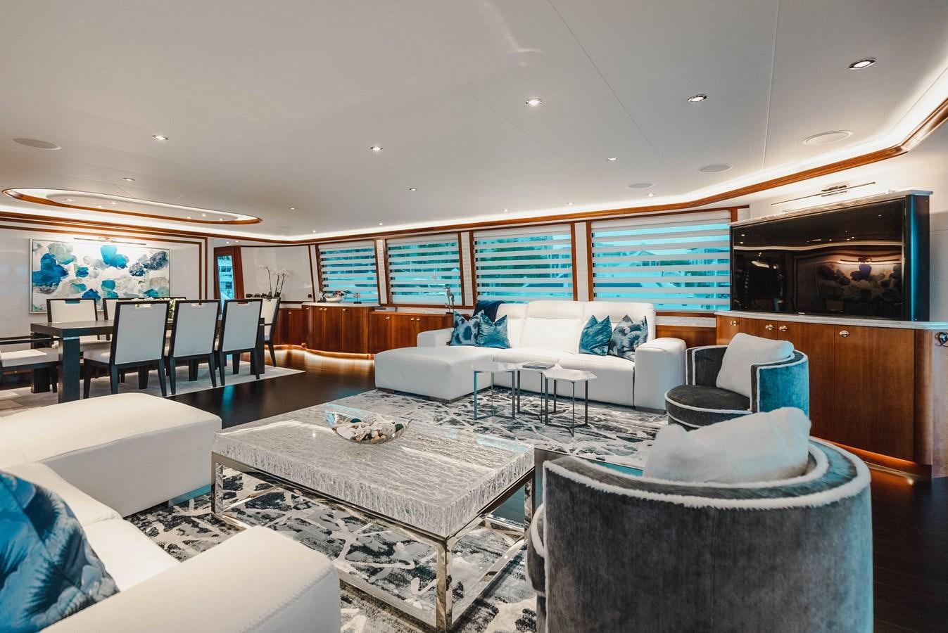 a room with couches and chairs aboard LA LADY Yacht for Sale